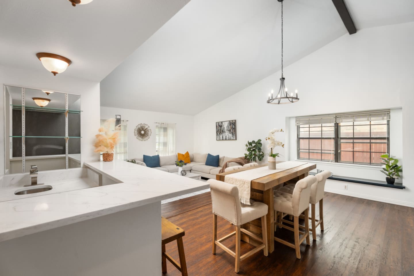 Bright open-concept living + dining area, and wet bar perfect for gathering with family and friends.