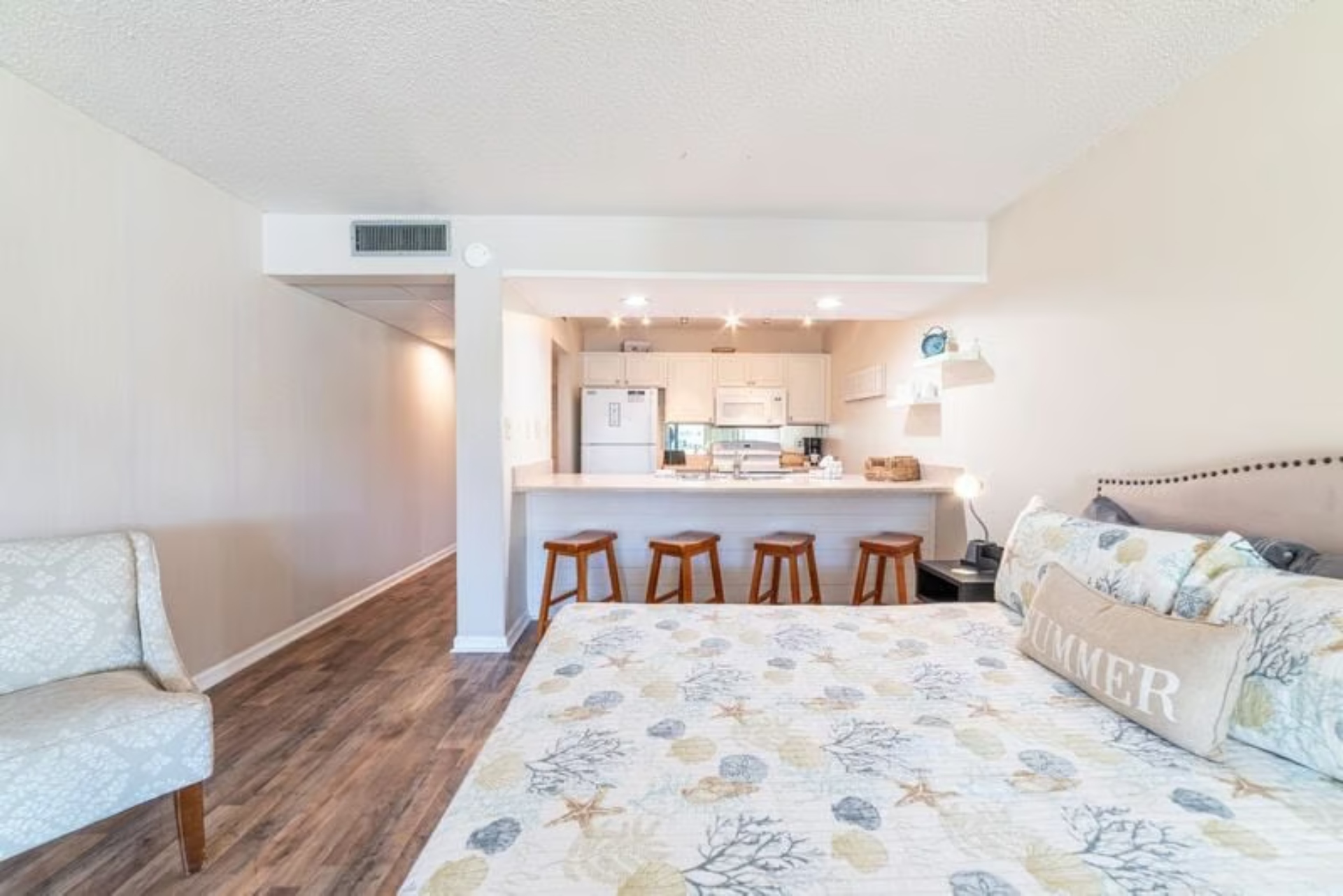 Bed + kitchen bar area