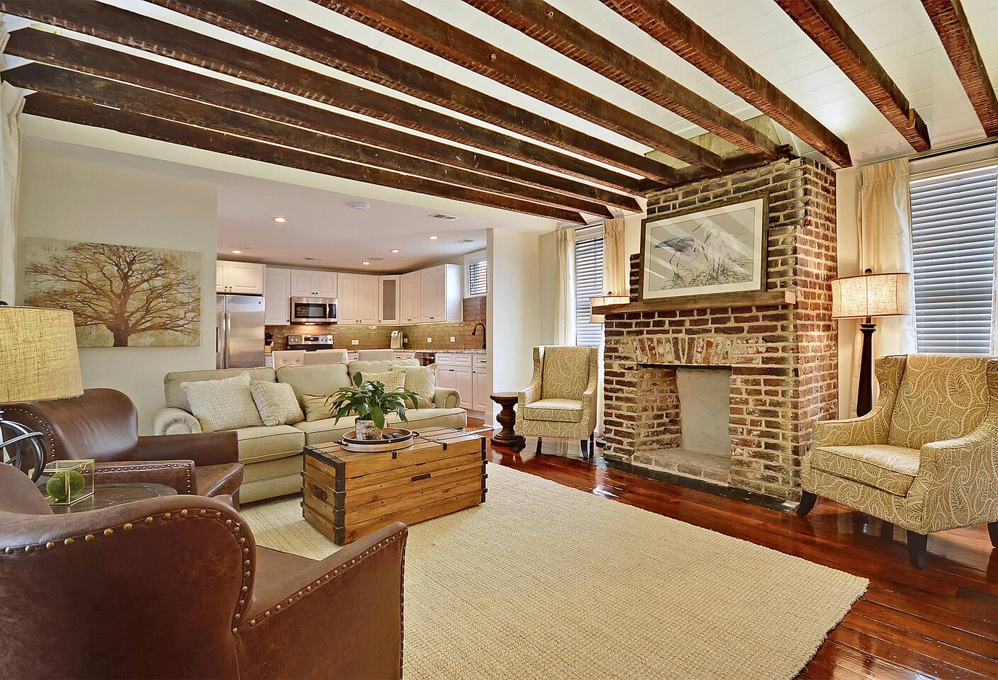Living room featuring cathedral ceiling with original beams 