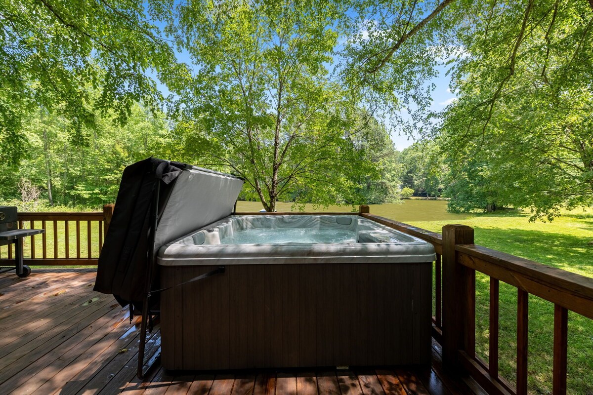 Hot tub is on the deck with great views of the water.