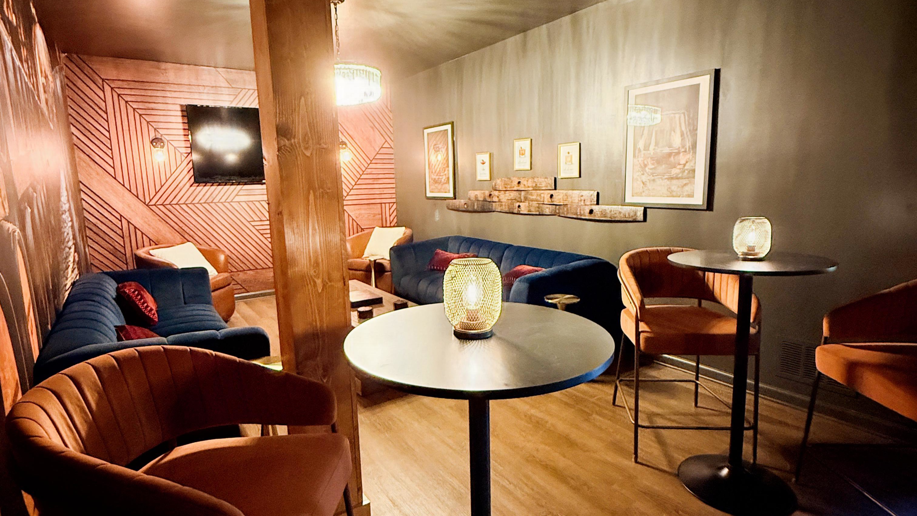 Descend to the Tasting Room — Rick Row 7 — a hidden lounge of rich textures, bourbon hues, and conversation-ready corners where design and comfort pour together perfectly.