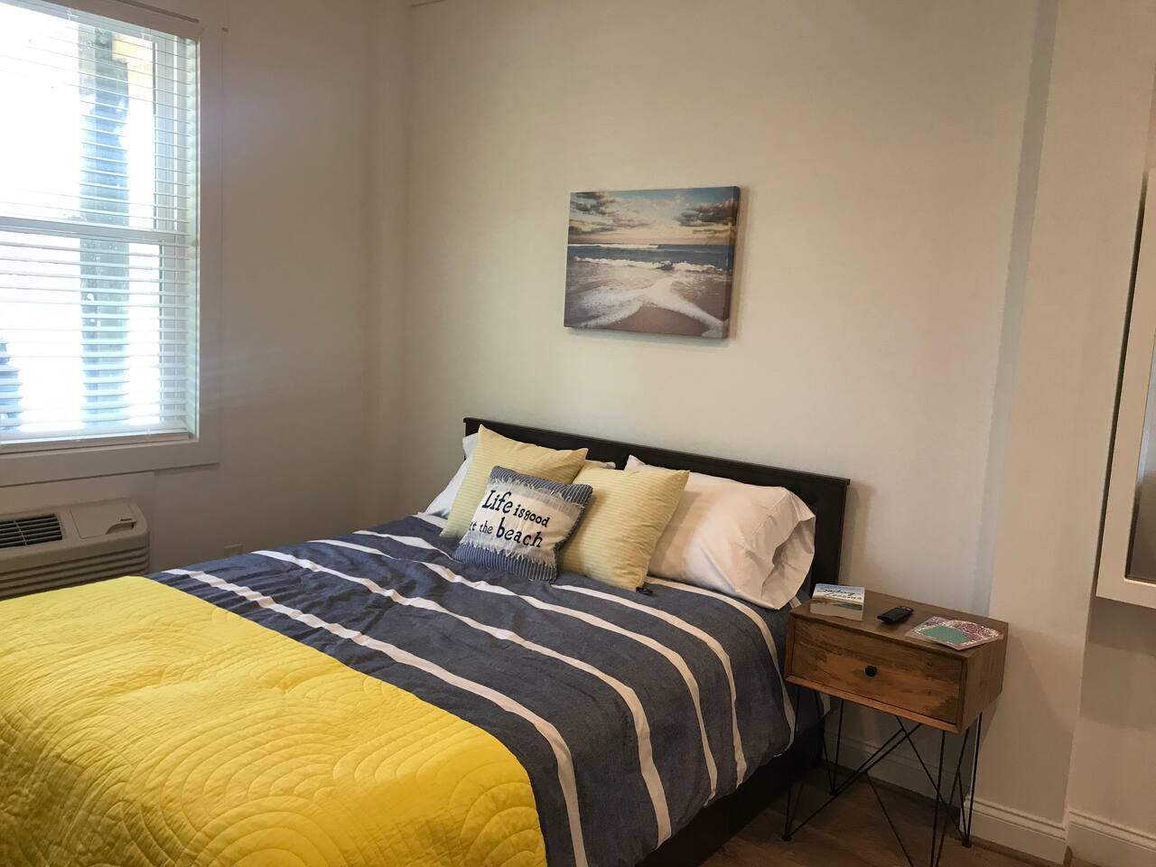 Queen bed with memory-foam mattress and underneath storage.