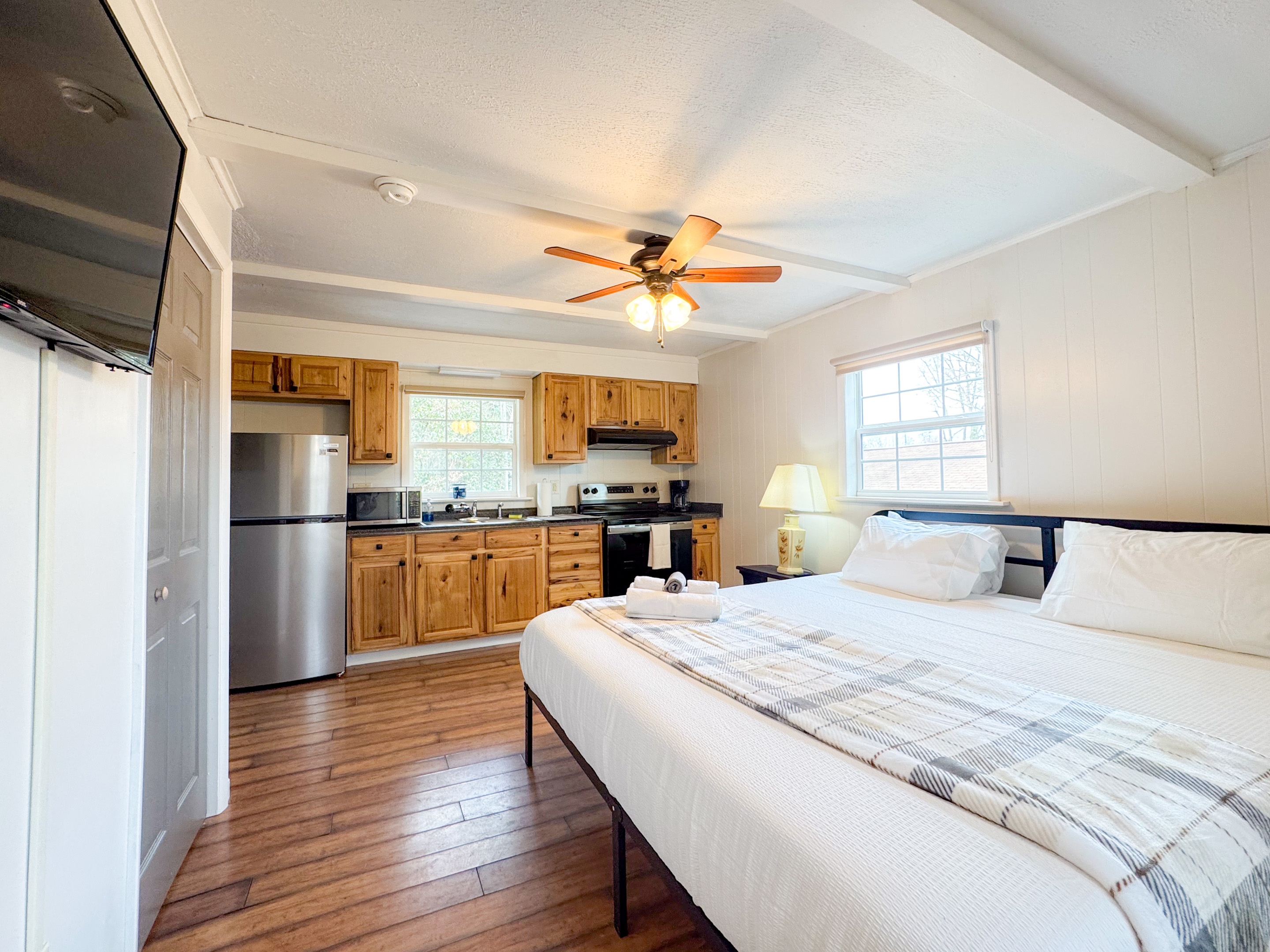 The separate apartment suite features a comfy King size bed with cooling memory foam gel and high thread count bedding. There is a smart TV, a small ensuite bathroom, refrigerator, coffee maker, and some kitchen items. Mostly for drinks and such.