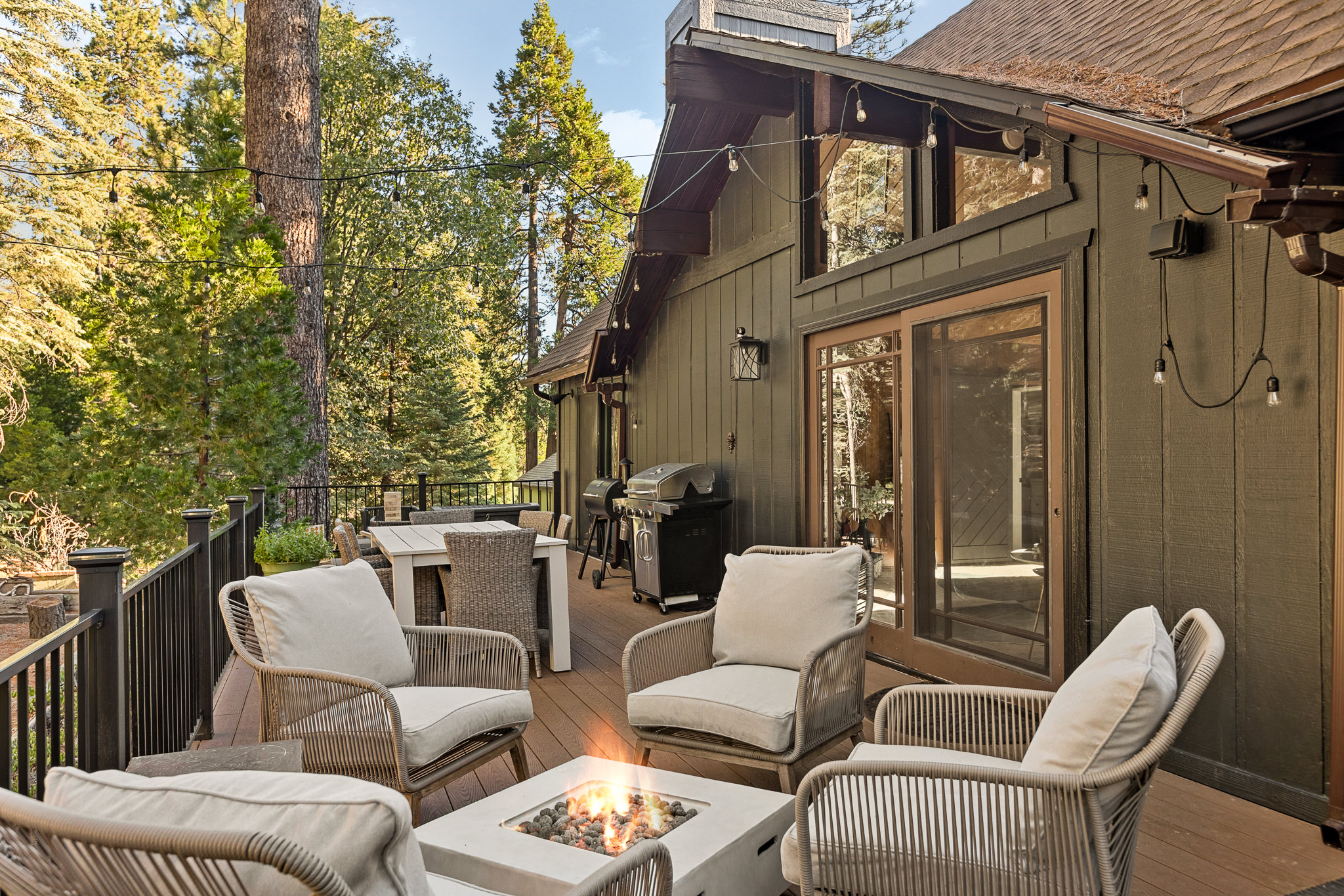 The spacious upper deck offers it all: outdoor dining, a cozy seating area with a fire pit, entertaining outdoor games, a BBQ, Smoker, and an outdoor heater!  Experience Lake Arrowhead's beauty to the fullest with this exceptional setup.