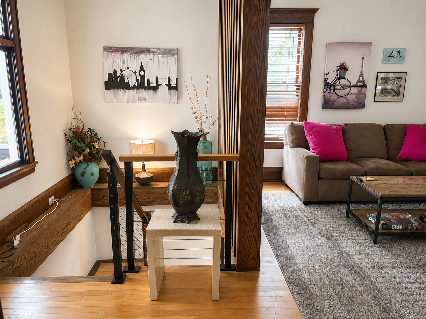 Staircase to the basement apartment area, adjacent to living room. Downstairs apartment area has two other bedrooms, a kitchen and bath. Residents can share an entrance, and can move freely throughout large apartment.