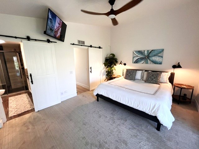 Primary with vaulted ceilings & direct patio access
