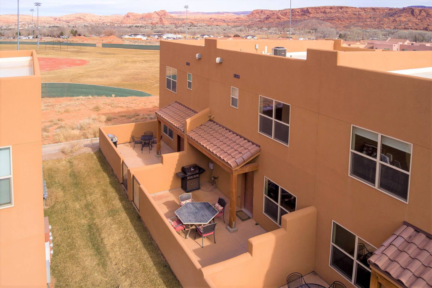 Private patio with dining set and BBQ