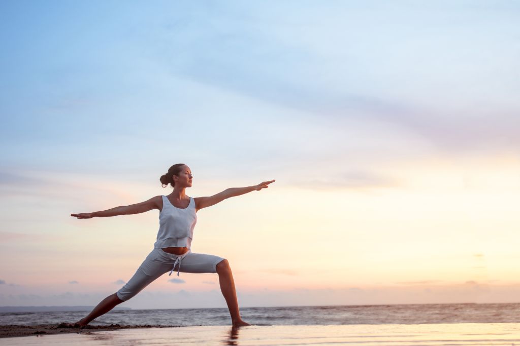 Morning yoga by the Gulf — breathe, stretch, and find your balance.