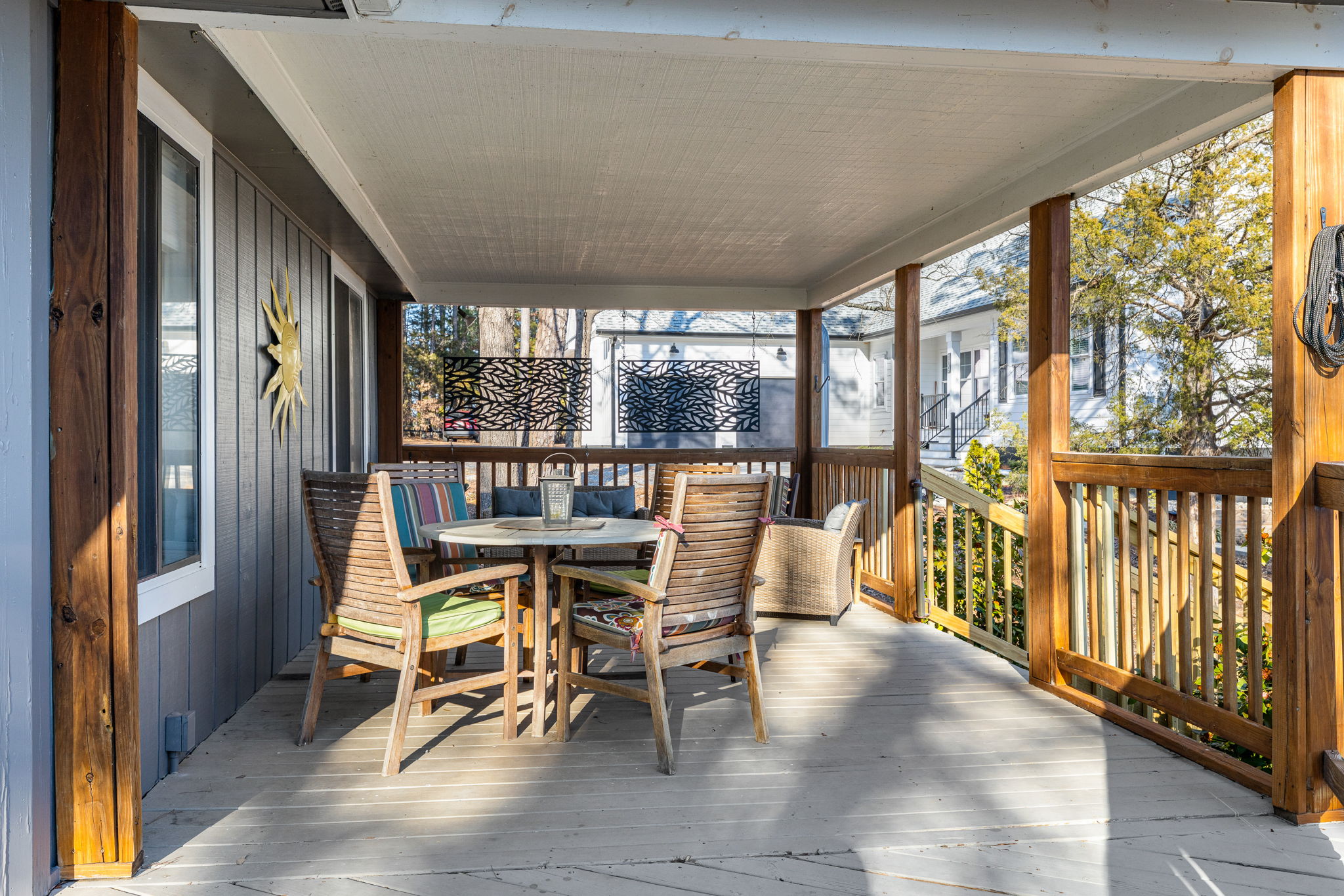 Porch: Unwind in style on this spacious deck with vibrant seating and lovely views!
