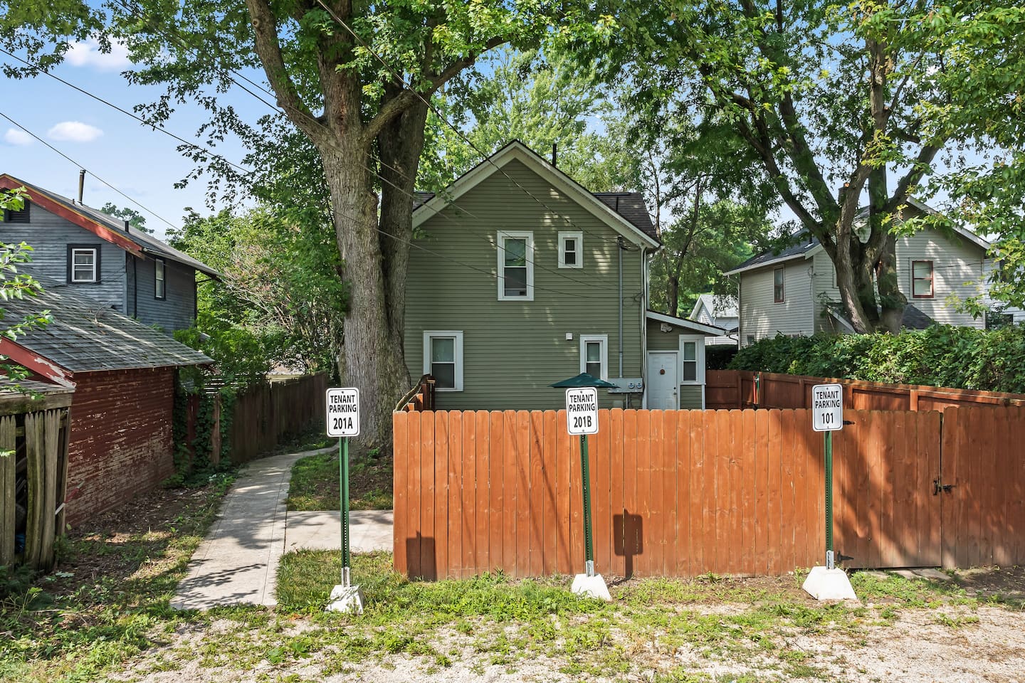 A side path leads to the fenced yard, offering a bit of extra seclusion.
