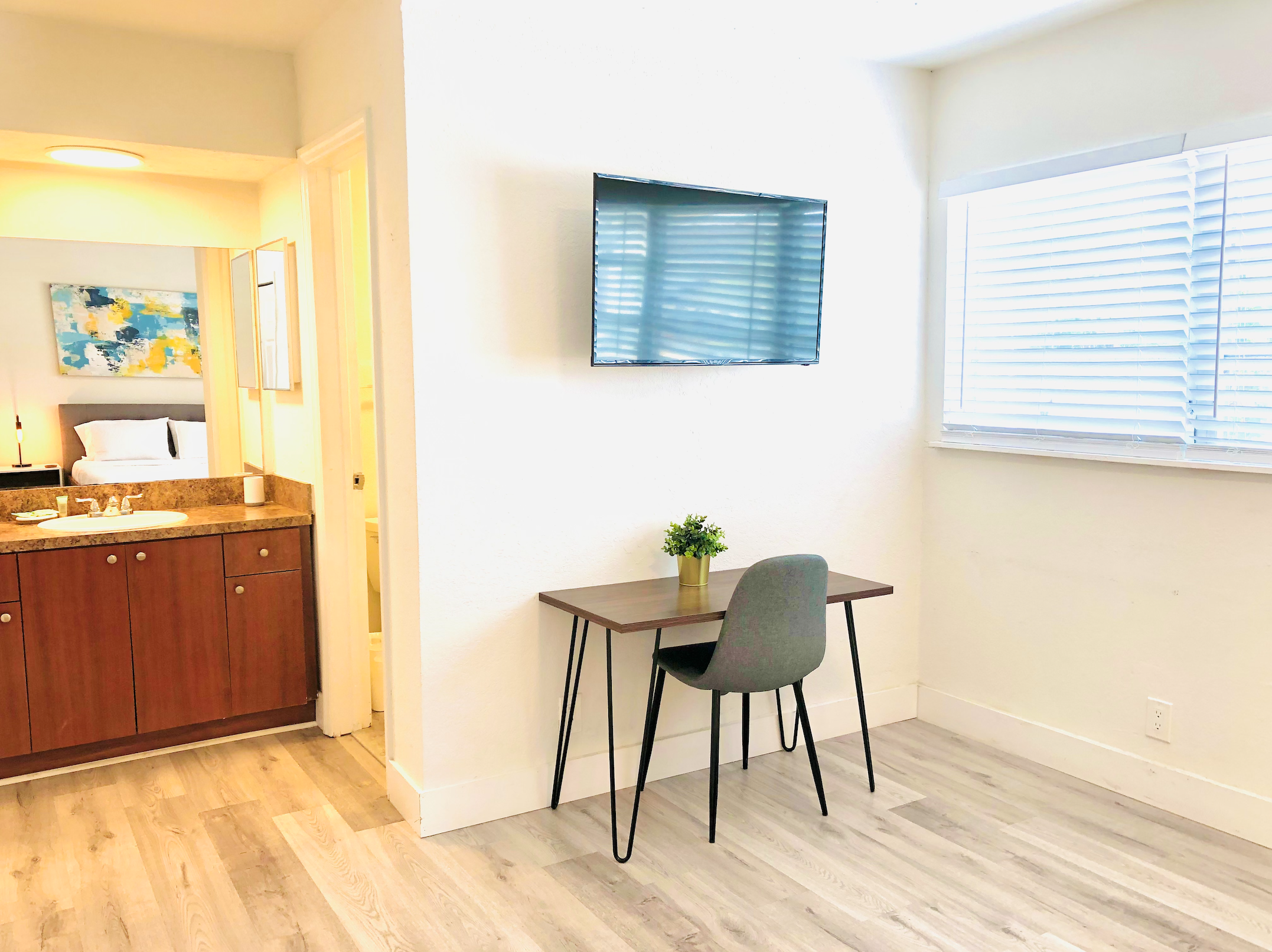 Featuring Roku TV and dining table and workstation