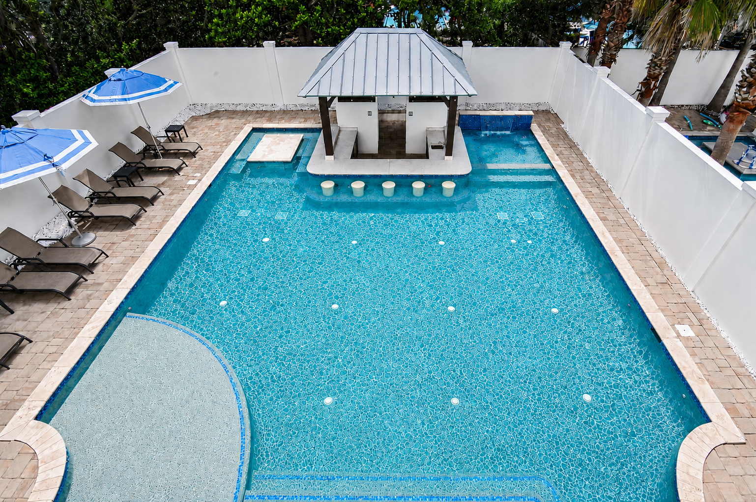 Resort-style pool, swim-up bar, and spa designed for all ages