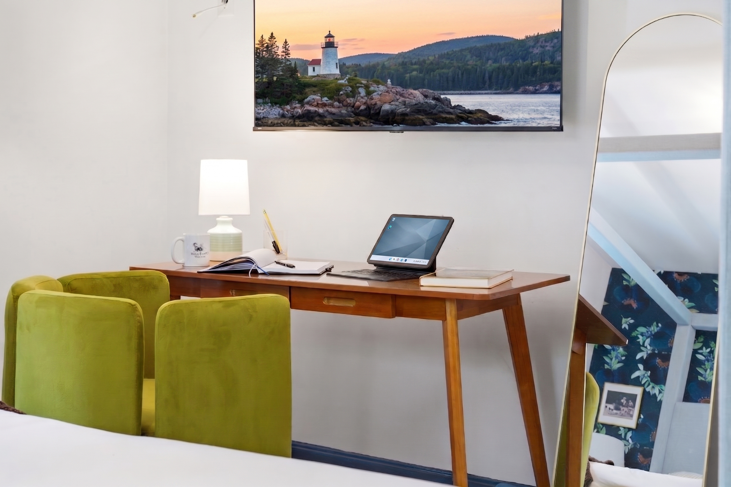 A cozy bedroom featuring a dedicated workspace, thoughtfully designed for comfort and productivity in a peaceful setting.