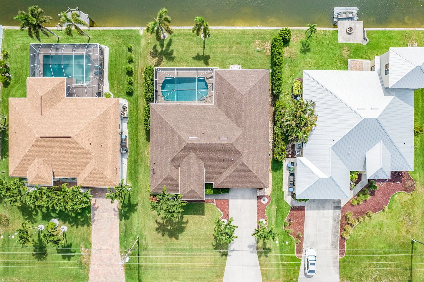Bird’s-eye view of Villa Sirena with stunning pool and waterfront views!