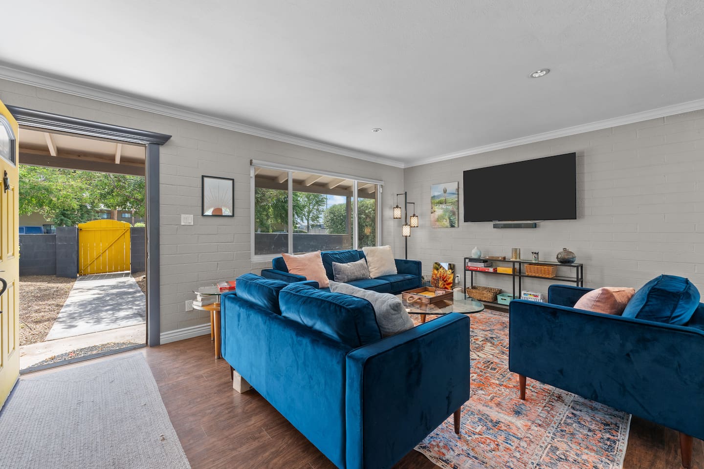 Living room with easy front door access and an open, airy feel.