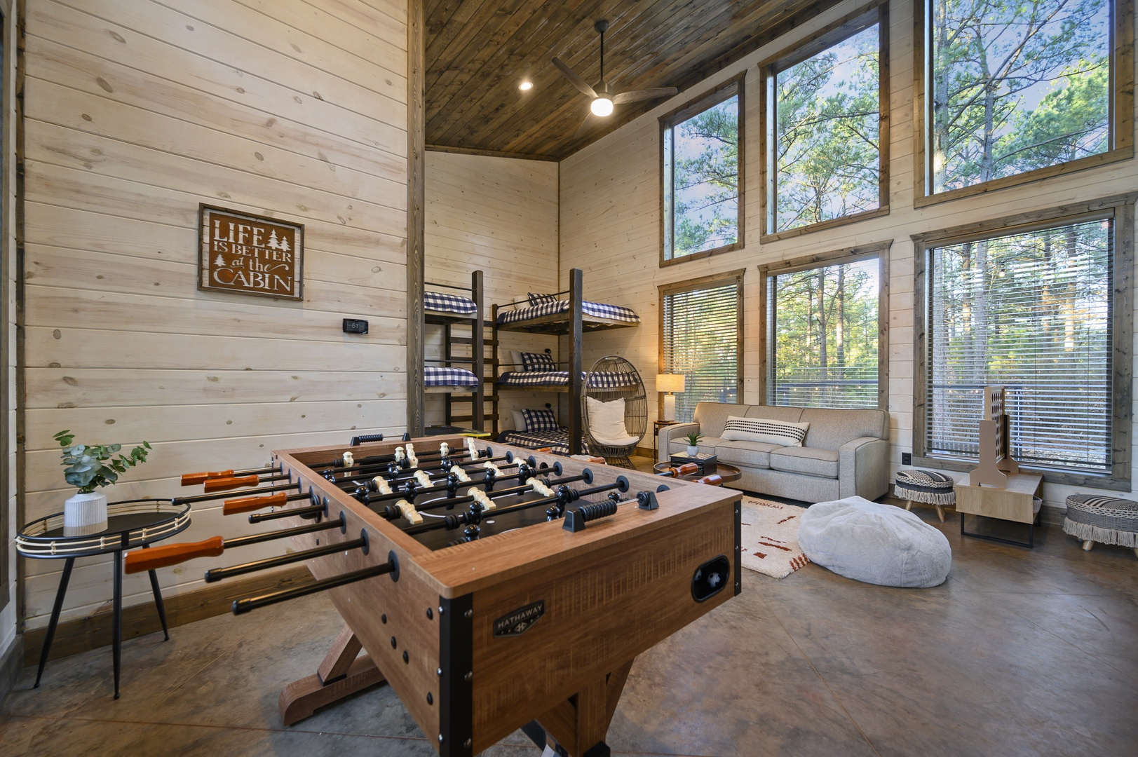 Challenge friends to foosball, hang out in the bunkhouse, or just unwind with forest views and cozy cabin vibes all around.