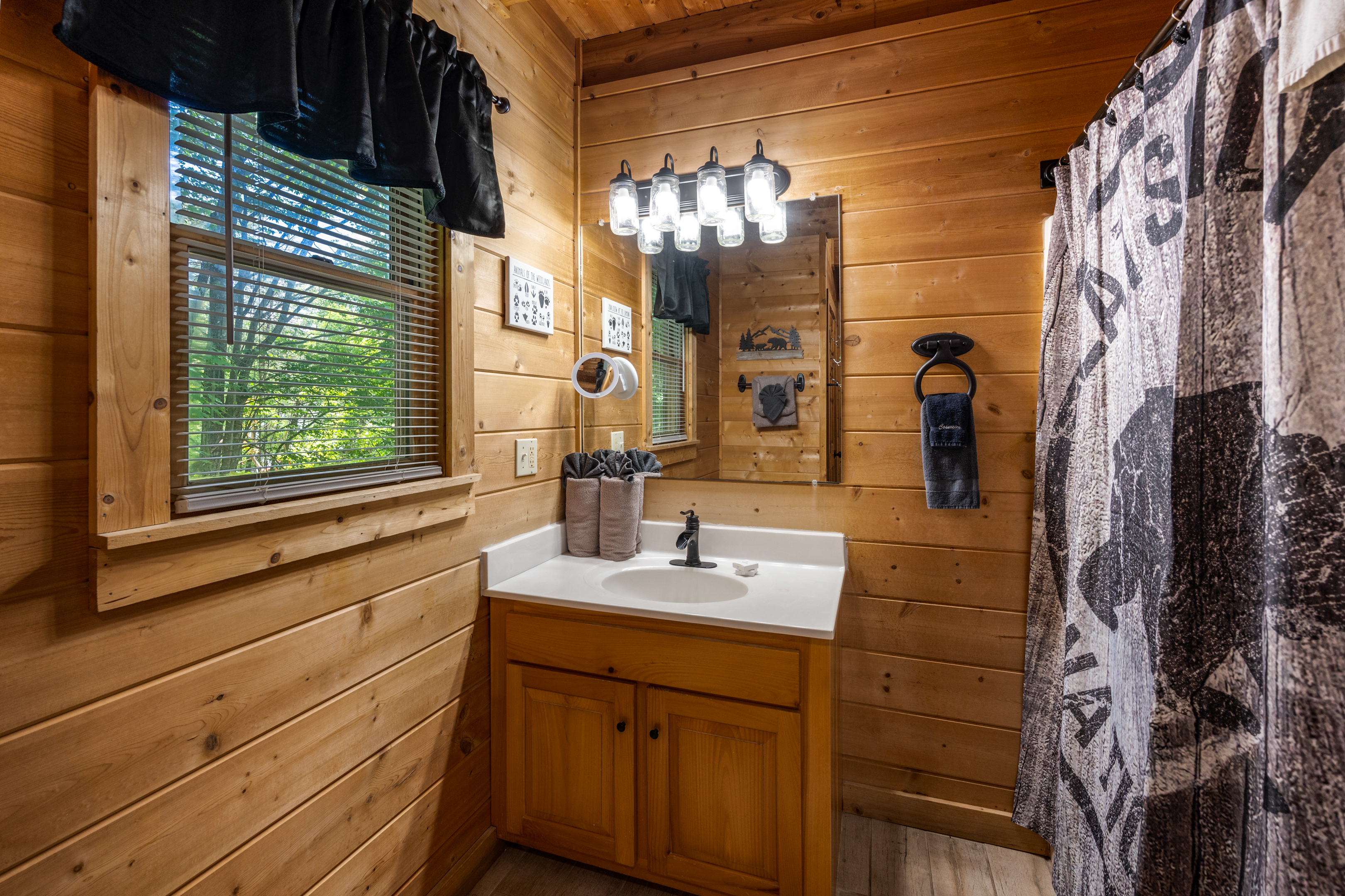Loft bathroom vanity and shower/tub combo.