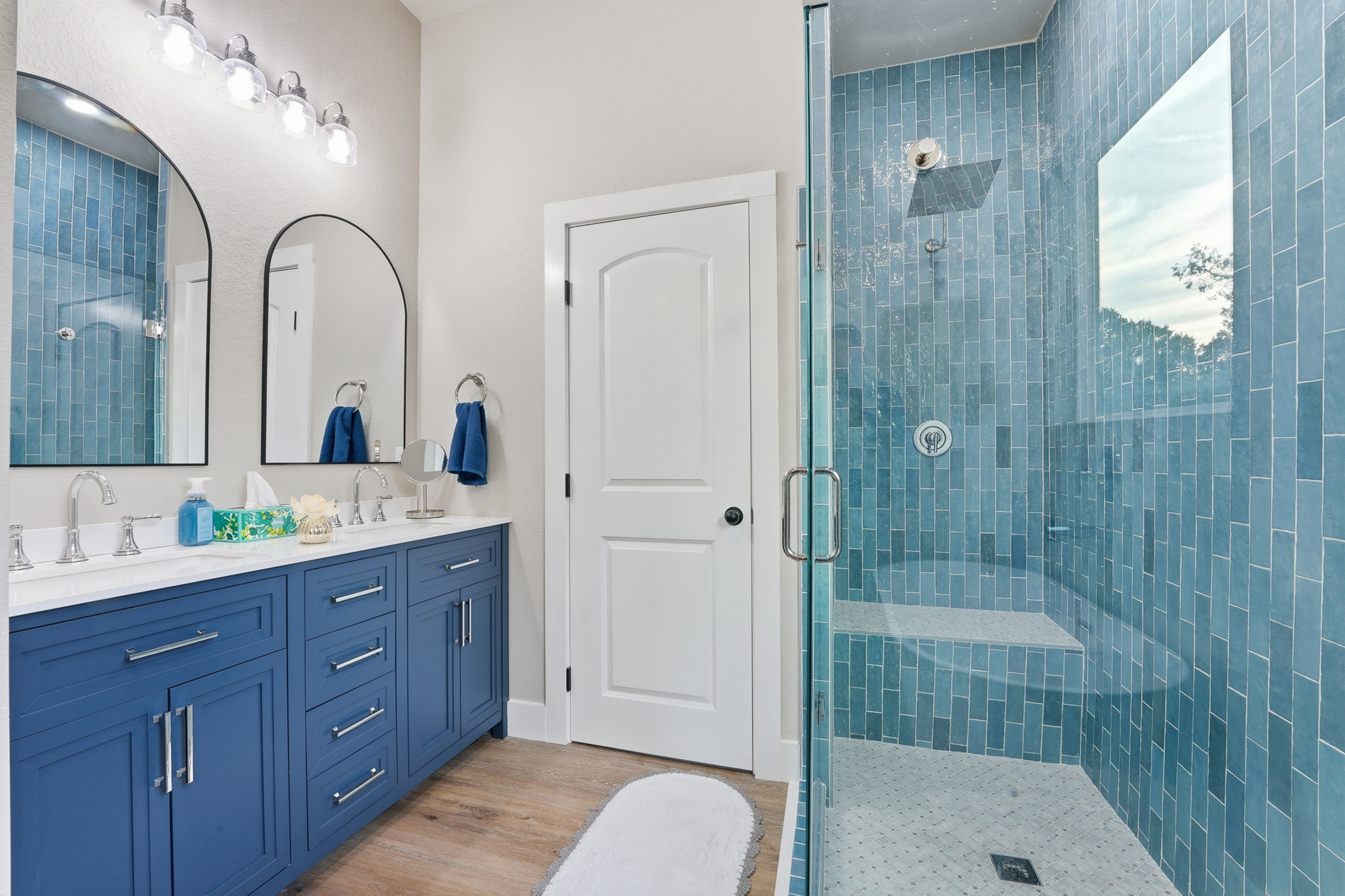 Well-appointed primary ensuite with dual sinks and separate walk-in shower for added convenience.