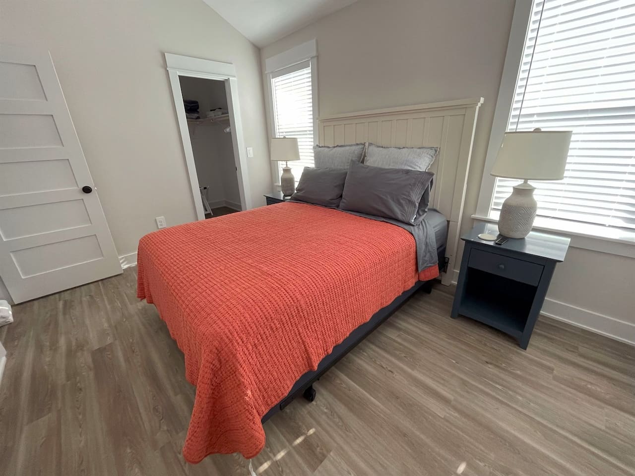 Another view of the third bedroom with queen bed -- a bright and comfortable guest bedroom designed for a relaxing stay.