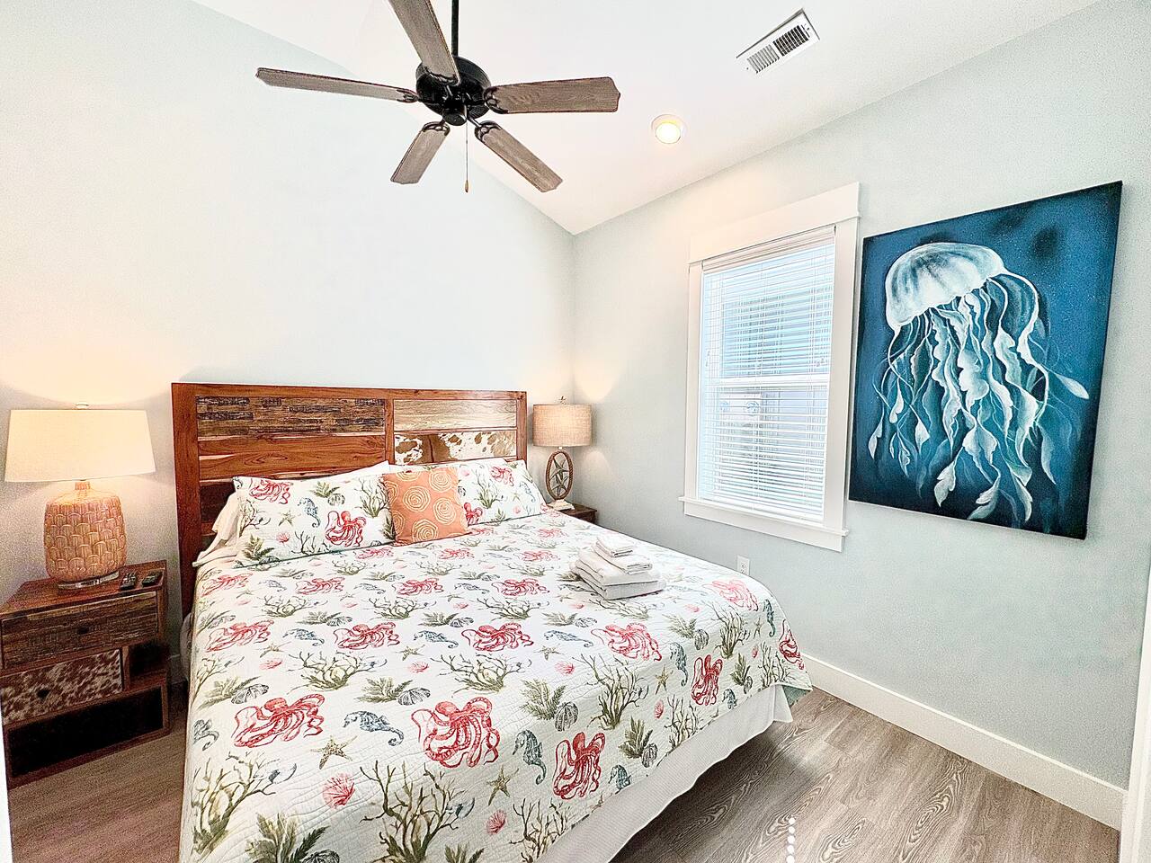King Bedroom 1 with coastal décor and natural light