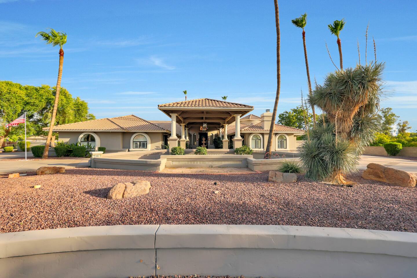 The architectural symmetry and grand entryway make a stunning first impression as you approach the home.