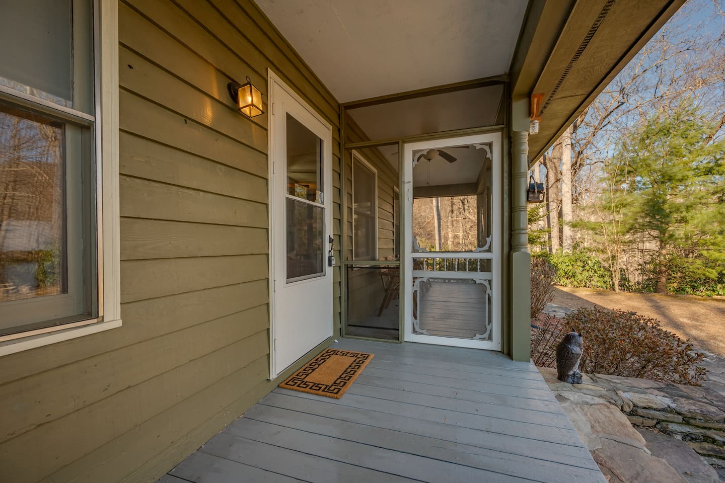 Front door entrance with porch with seating 