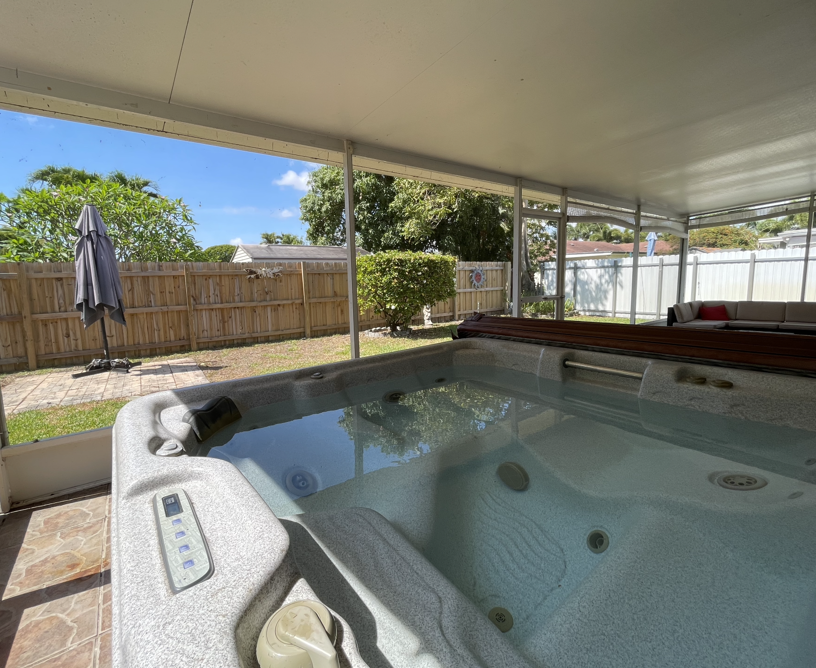 Relax and unwind in the hot tub, taking in the garden views from the convenience of our sunroom.