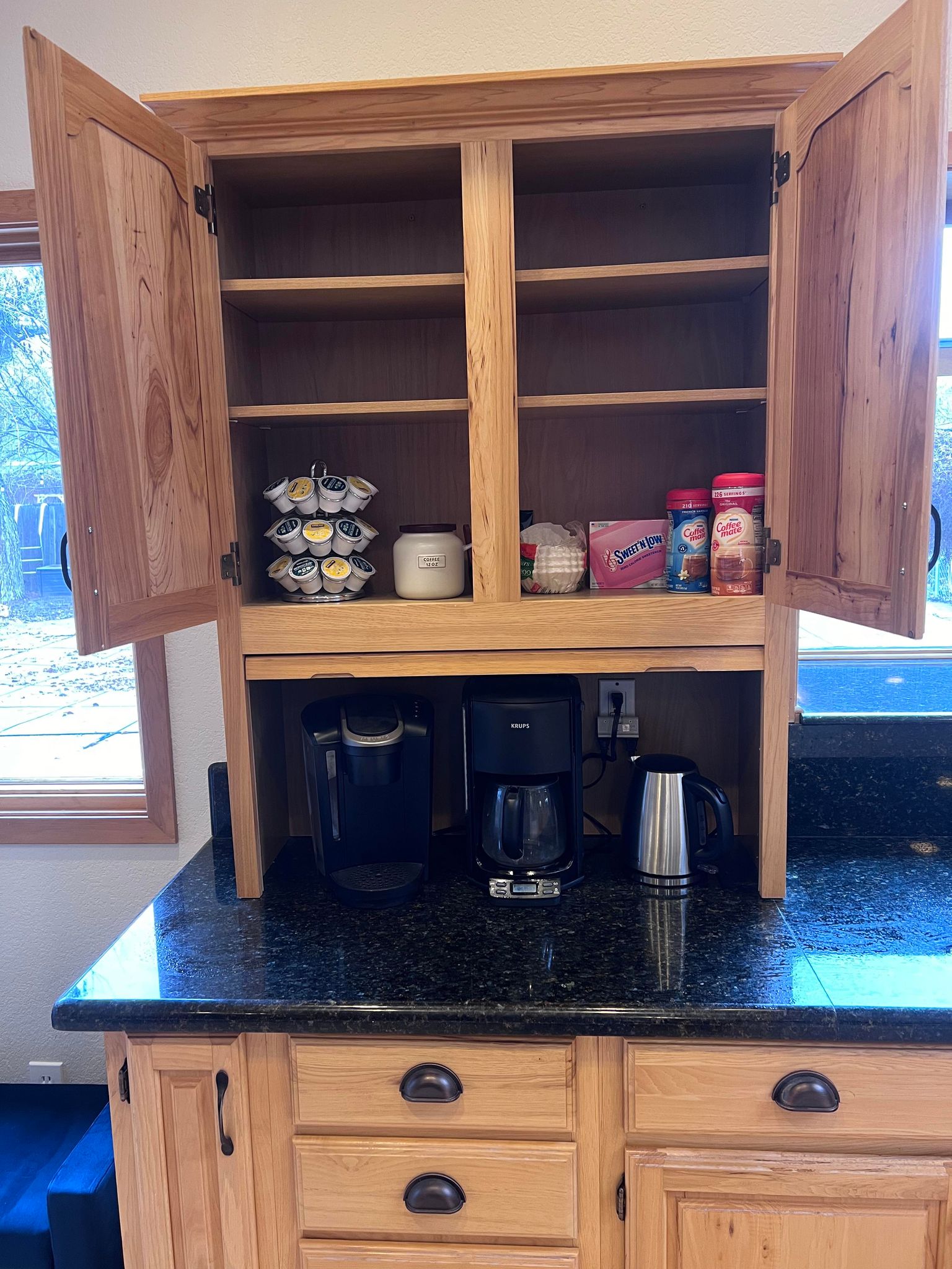 Full Coffee Station with  Kurig, coffee maker and stainless steel electric water kettle. Featuring coffee and tea for your stay.