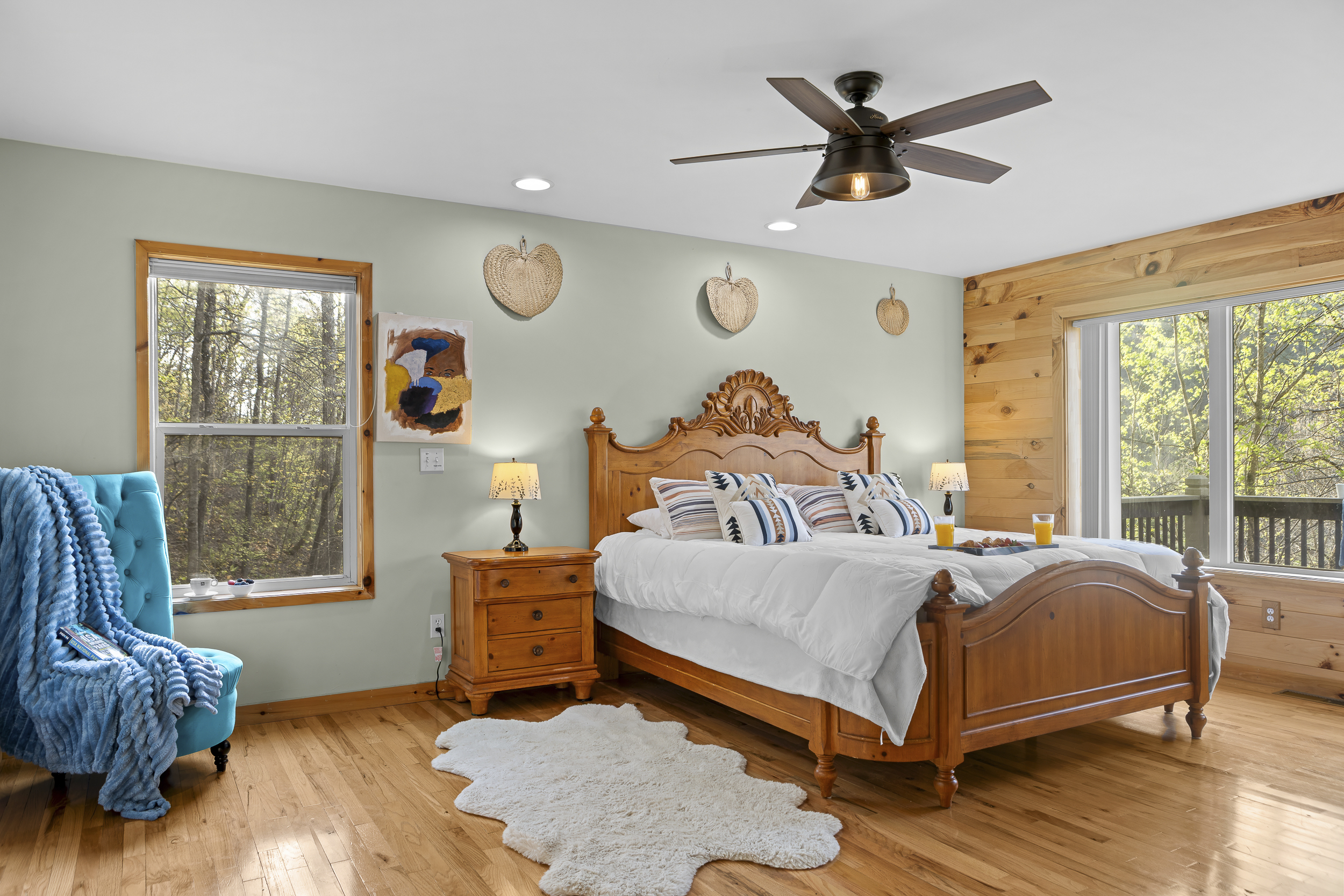 Master King Bedroom 1: Tranquil retreat with wood accents, comfy bedding, and nature views await you!