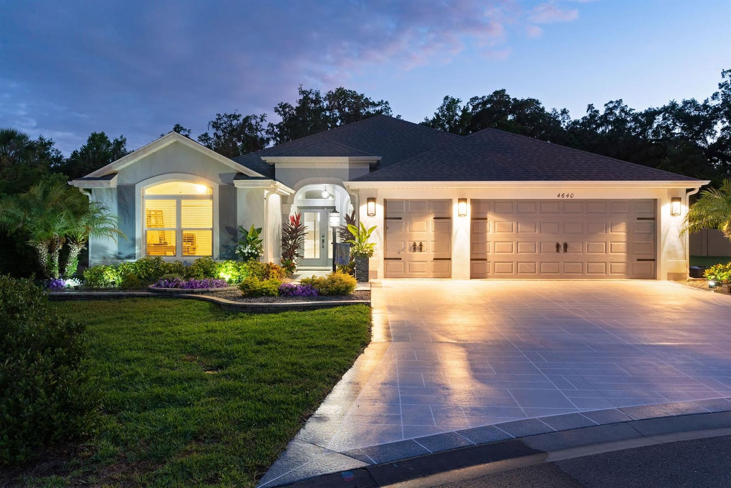 Beautifully lit exterior with stunning curb appeal