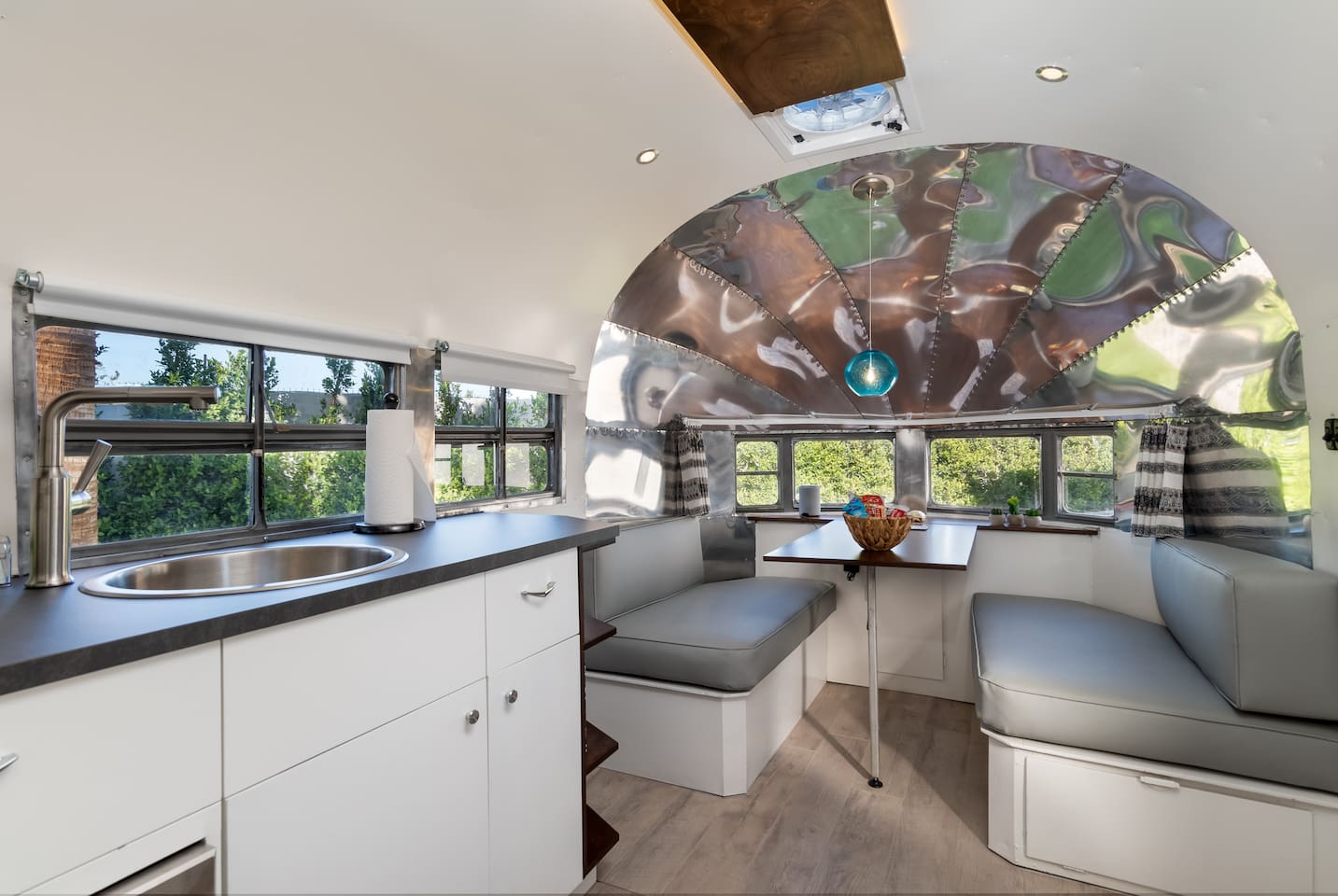 Kitchenette and leather dining booth for four