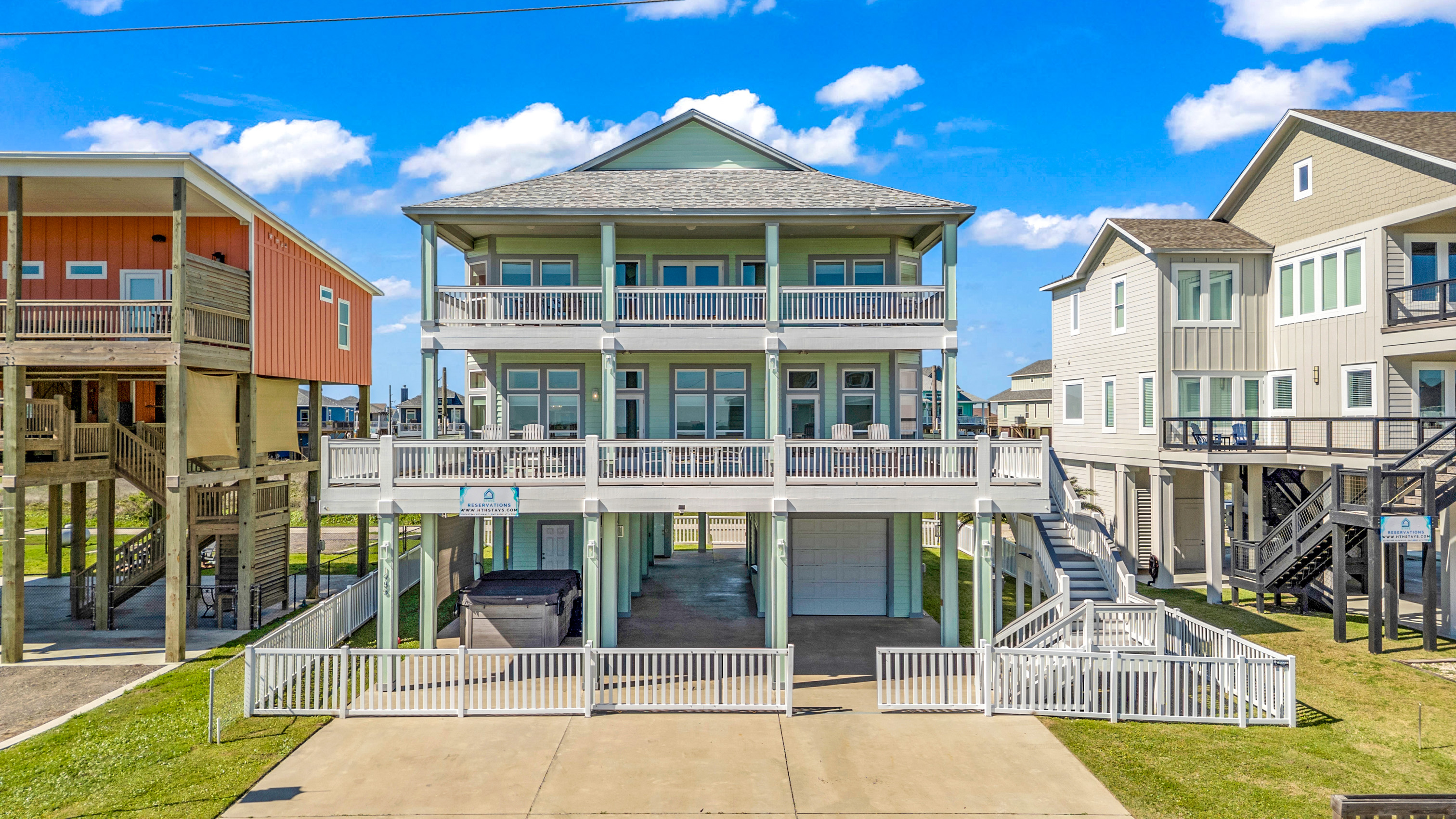 Crystal Paradise Exterior: Bright and airy beach retreat with wide balconies, ideal for enjoying morning coffee and ocean breezes.