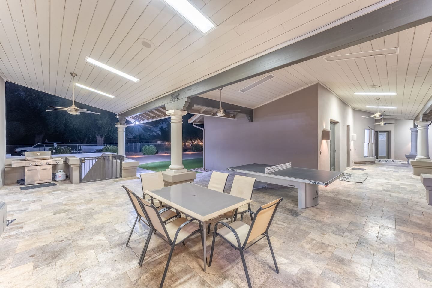 Serve up a game or a meal! This area combines fun and flavor with a ping pong table and built-in BBQ.