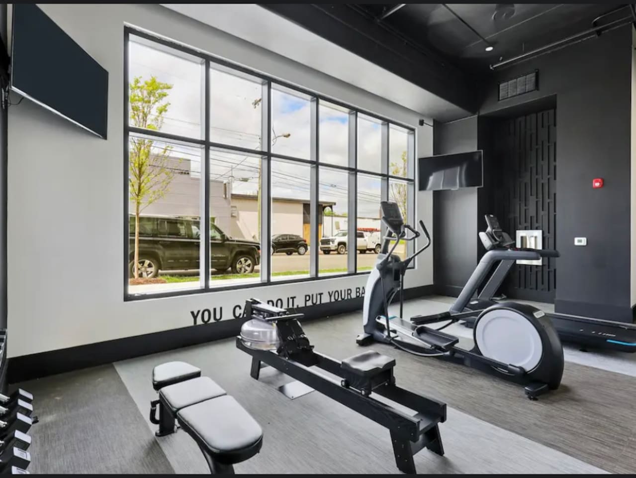 Fitness Room: Bright and airy space to energize your day with modern equipment and inspiring views!