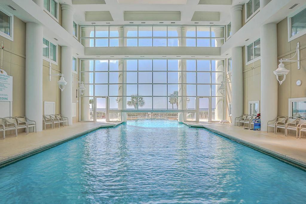 Indoor/outdoor heated pool w/ tall windows for year-round swimming.