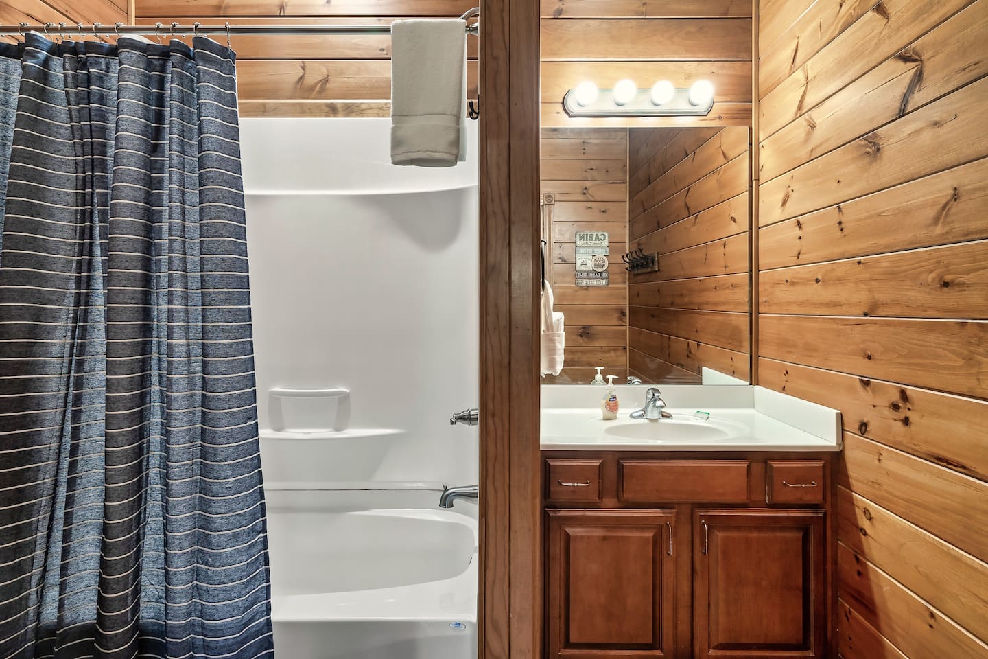 Full bathroom with shower/bathtub combo.