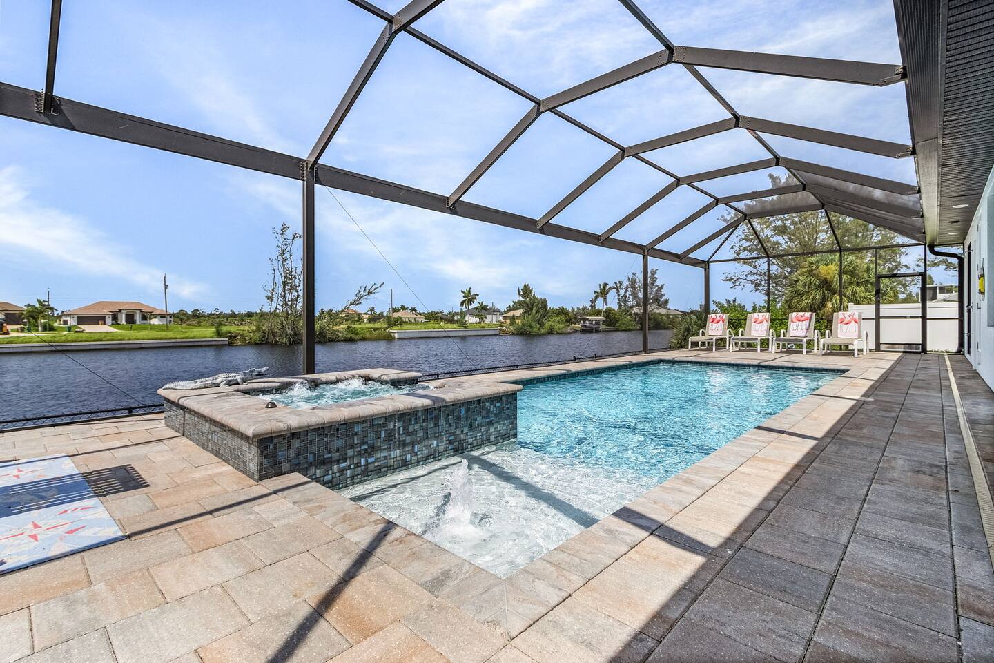 Stunning pool and spa area offering amazing water views for a truly exceptional experience!