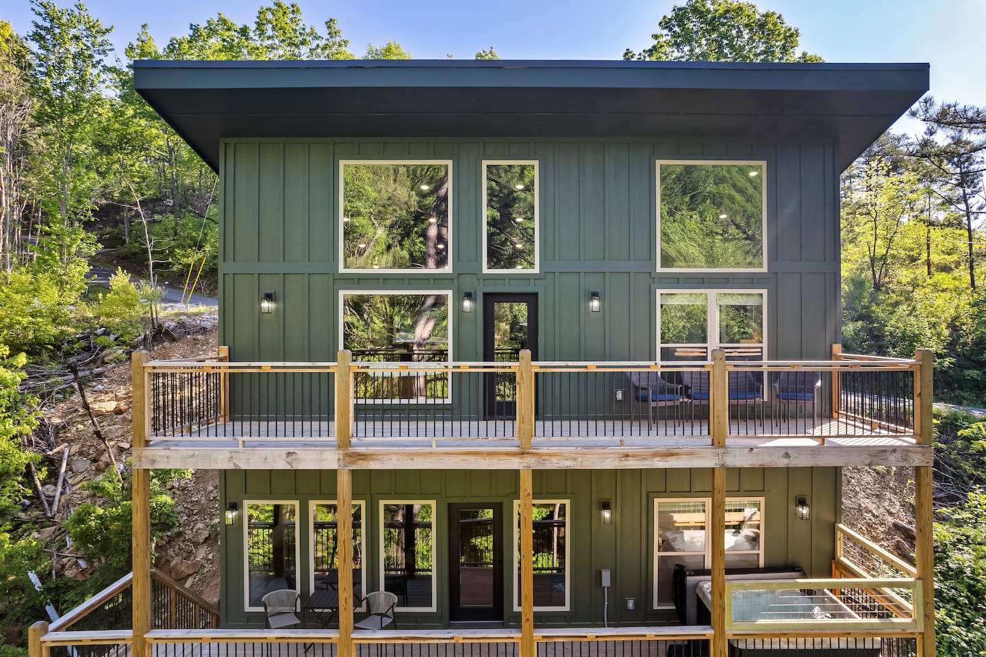 Two-level modern cabin with spacious decks and private hot tub.