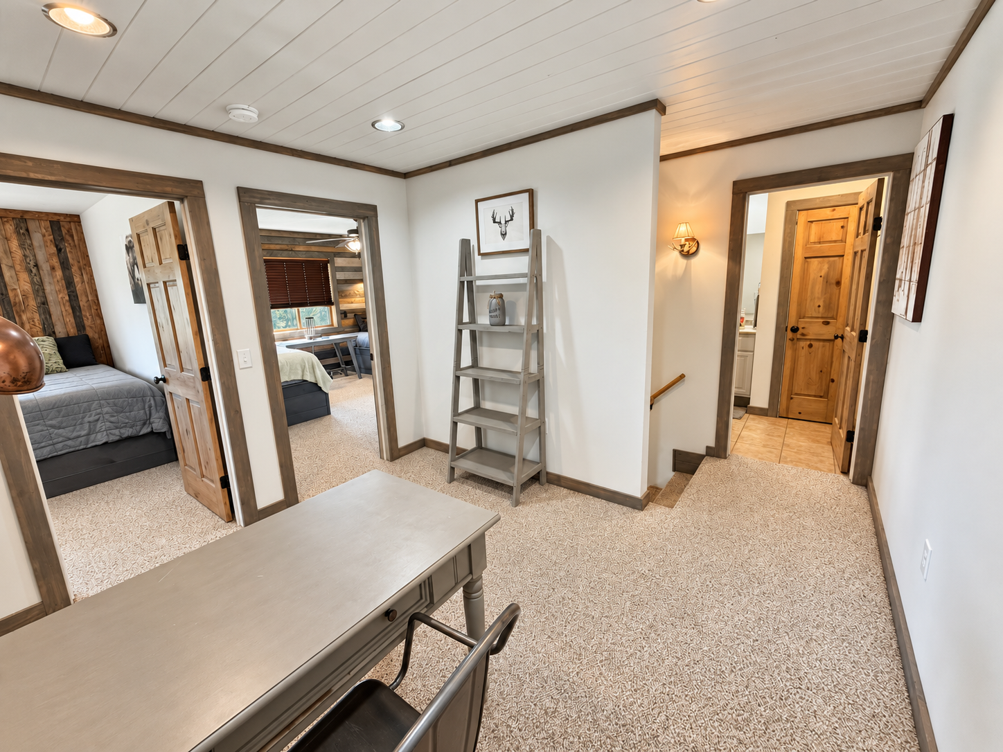At the top of the stairs, the full bathroom is conveniently positioned near all three upper-level bedrooms, making the layout easy and comfortable for families and groups.