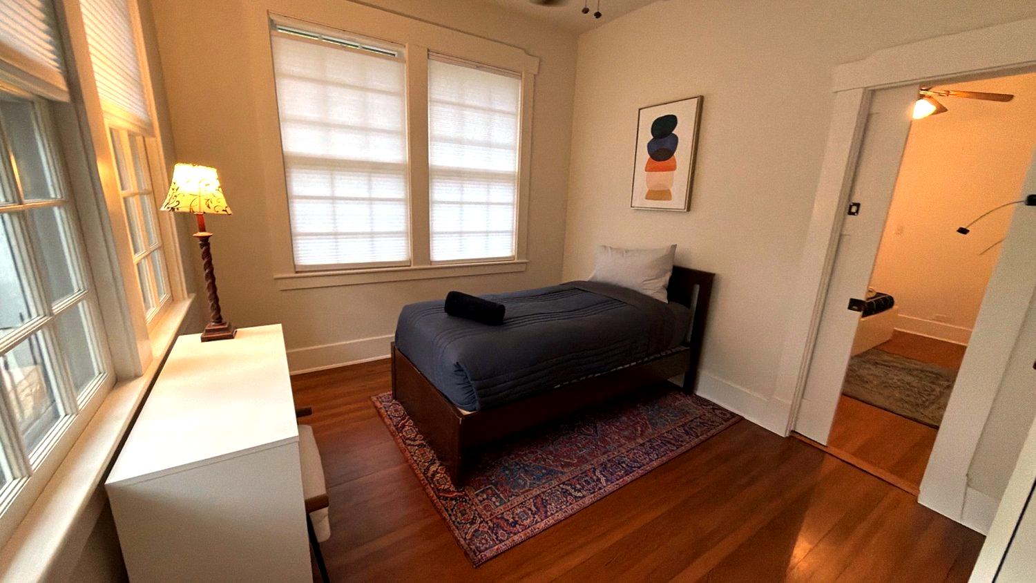 Comfortable single beds in a  cozy bedroom