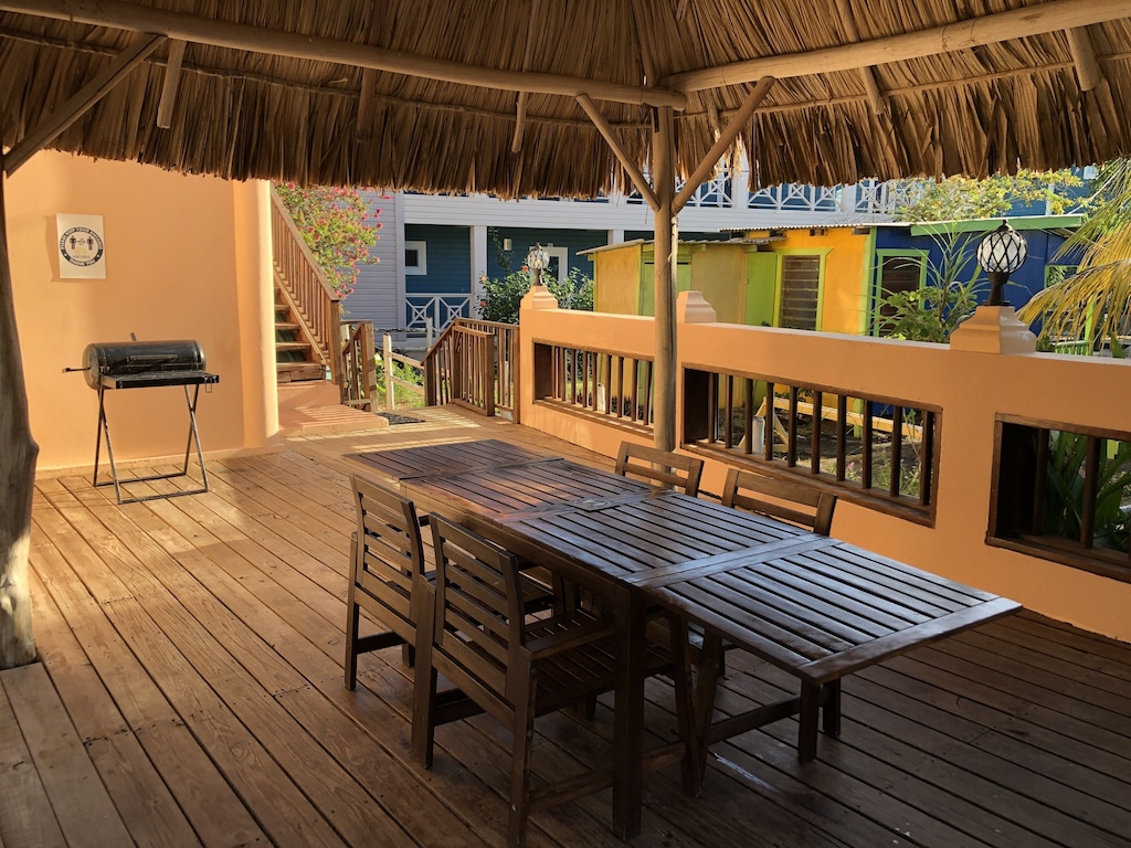 Shared, shaded seating area with the grill