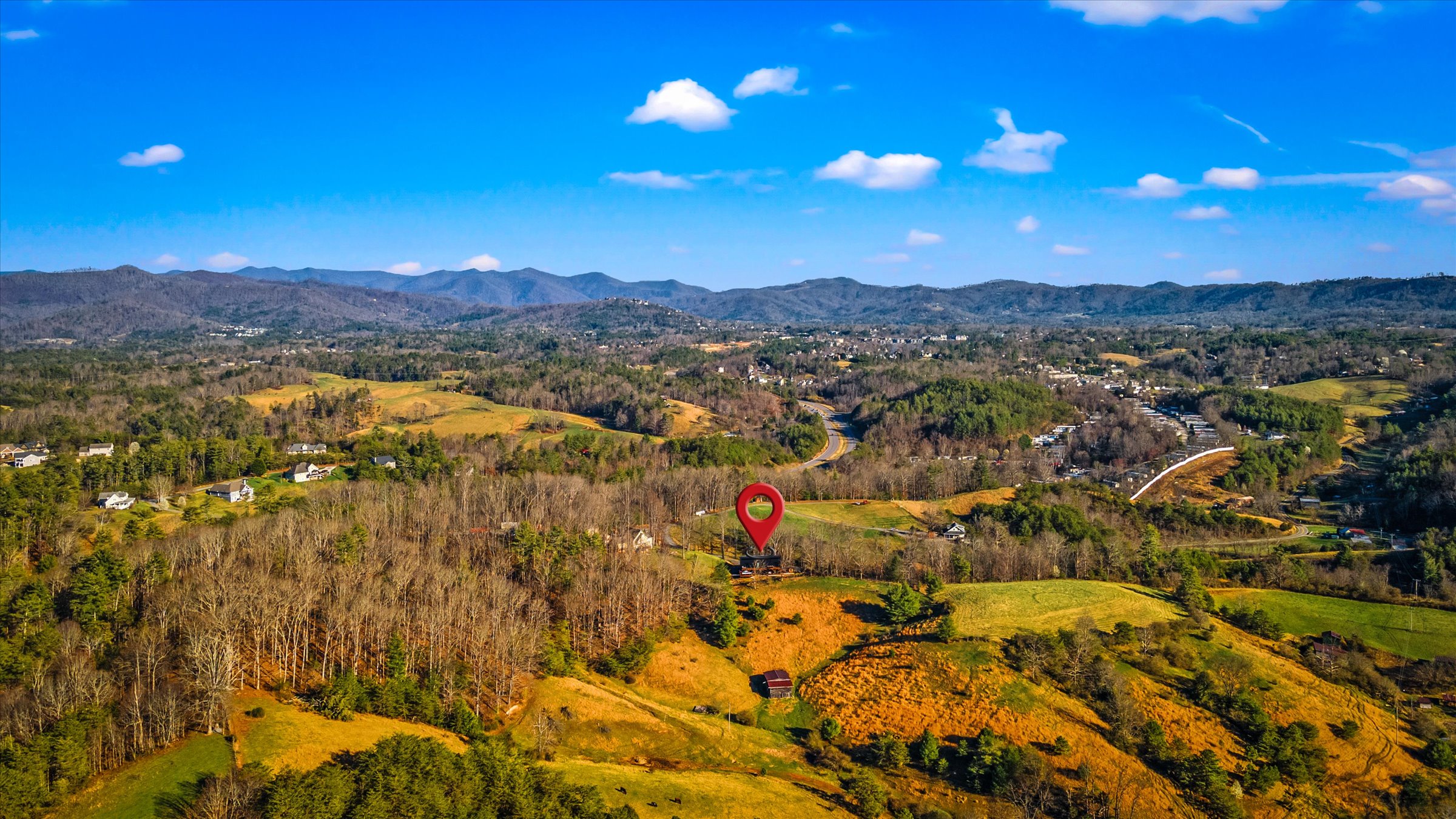{Aerial View + Location}
Nestled in the Blue Ridge Mountains on 2 private acres bordering farmland — offering privacy, panoramic views, while still 15 minutes to downtown Asheville.