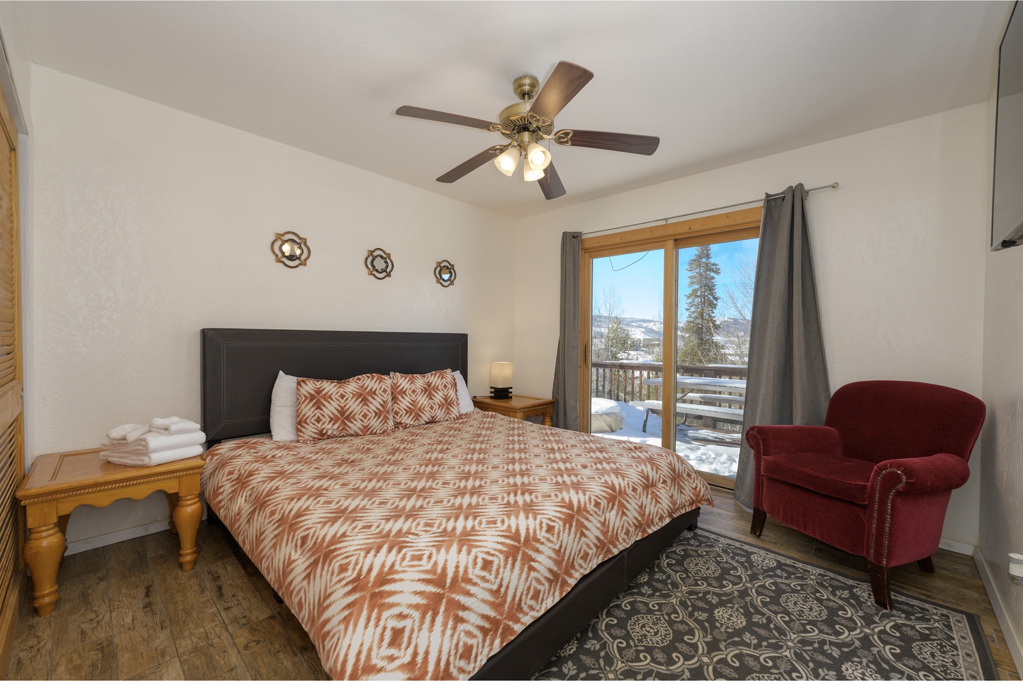 Bedroom with a sitting chair and mountain views