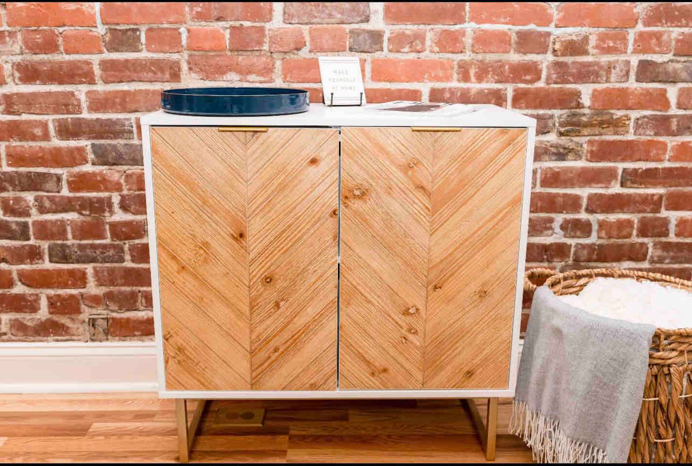 Convenient shoe cabinet in the living area, perfect for keeping your space organized and tidy.