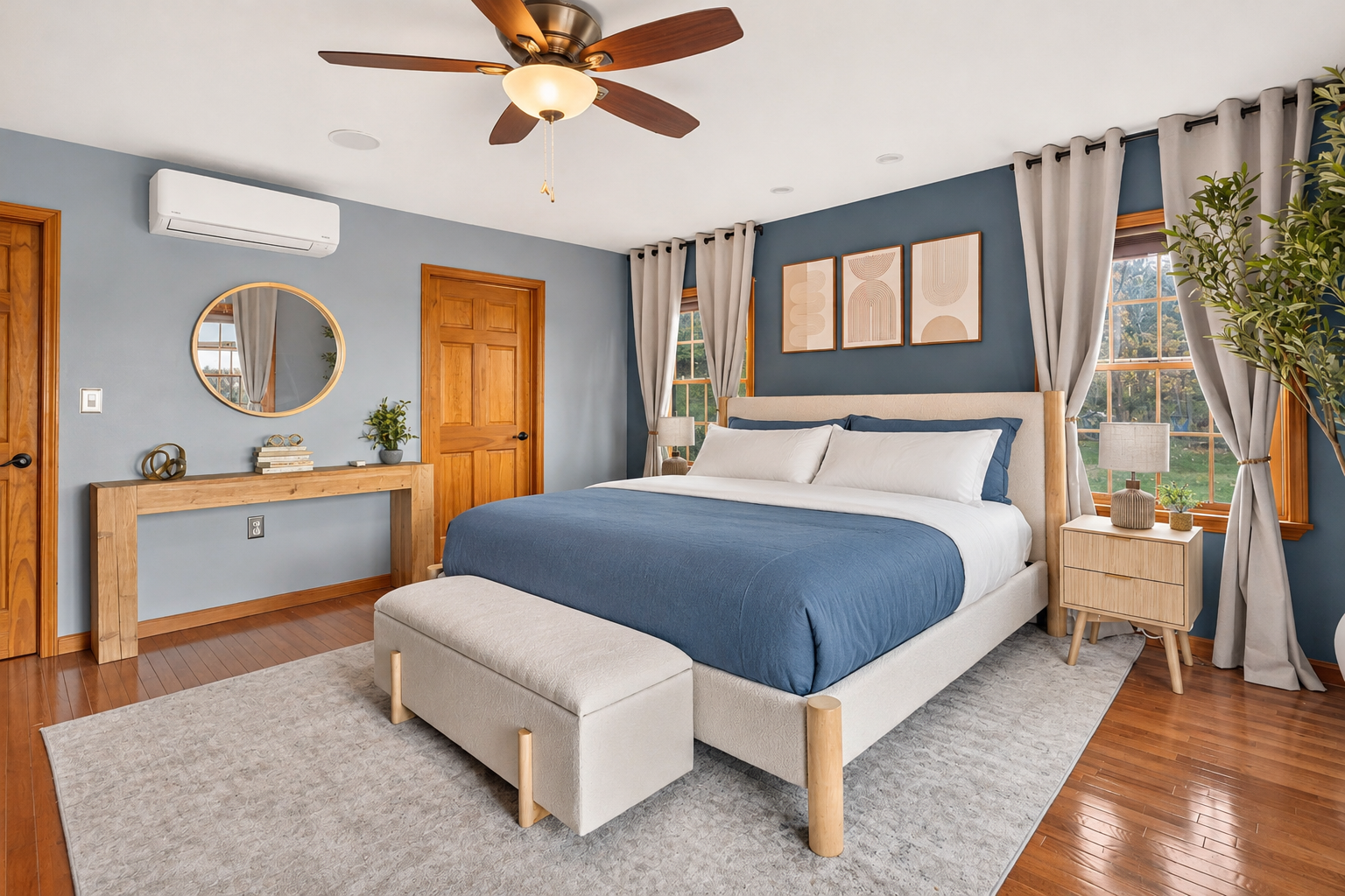 Bedroom with upholstered bench and wooden flooring