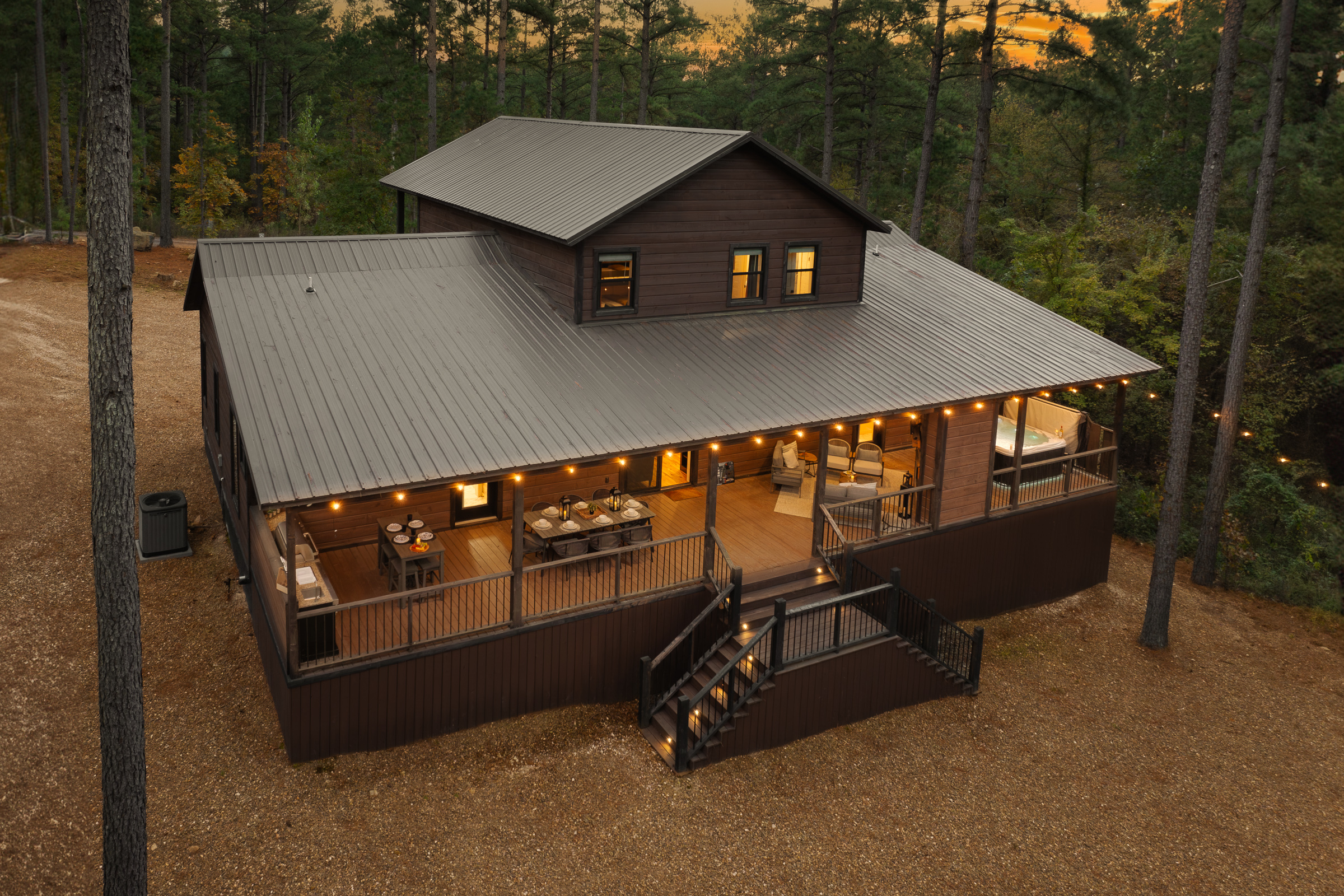A peaceful woodland retreat wrapped in warm glow. Pinewood Lodge welcomes you with privacy, comfort, and a design forward experience from the very first look.