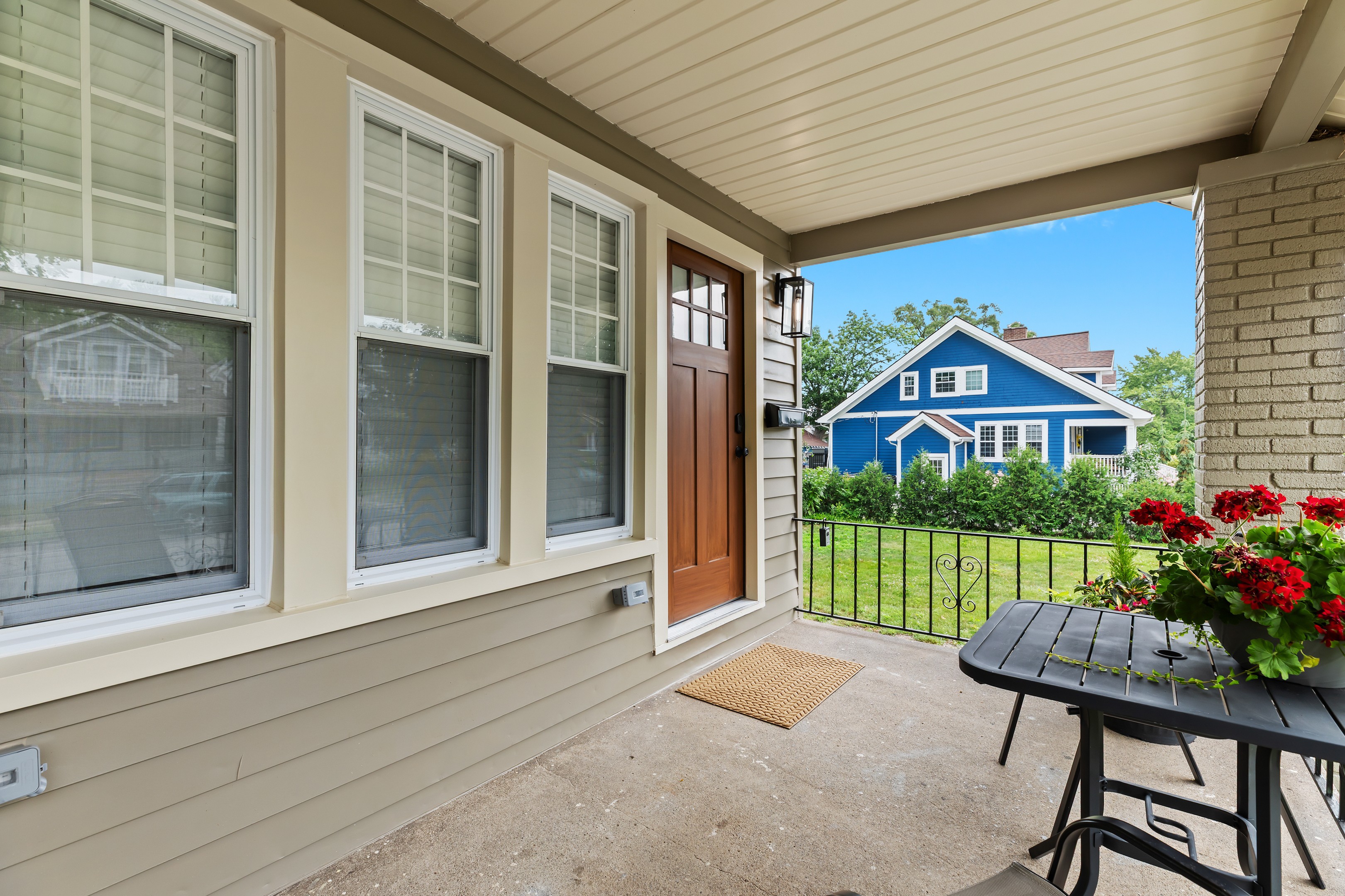 Spacious front porch offers room for outdoor dining or lounging in the fresh air.