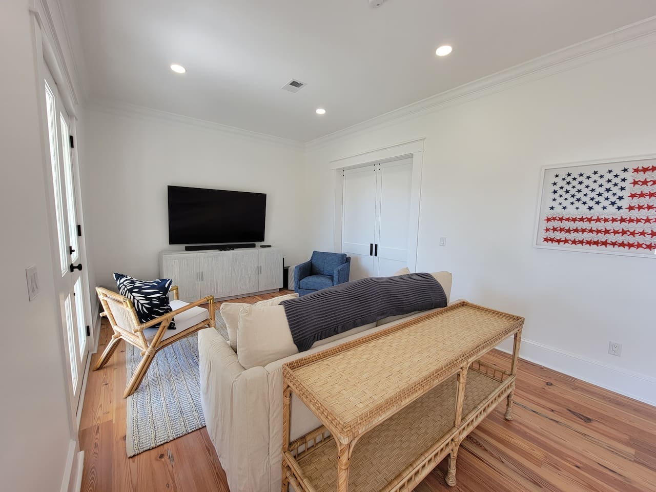 Den with large TV and sofa sleeper. 