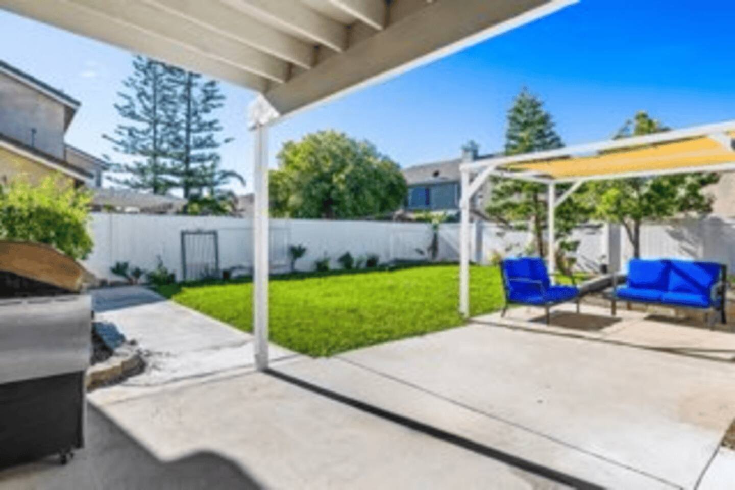 Expansive fenced backyard offering plenty of green space for outdoor fun, relaxation, and enjoying the fresh air.