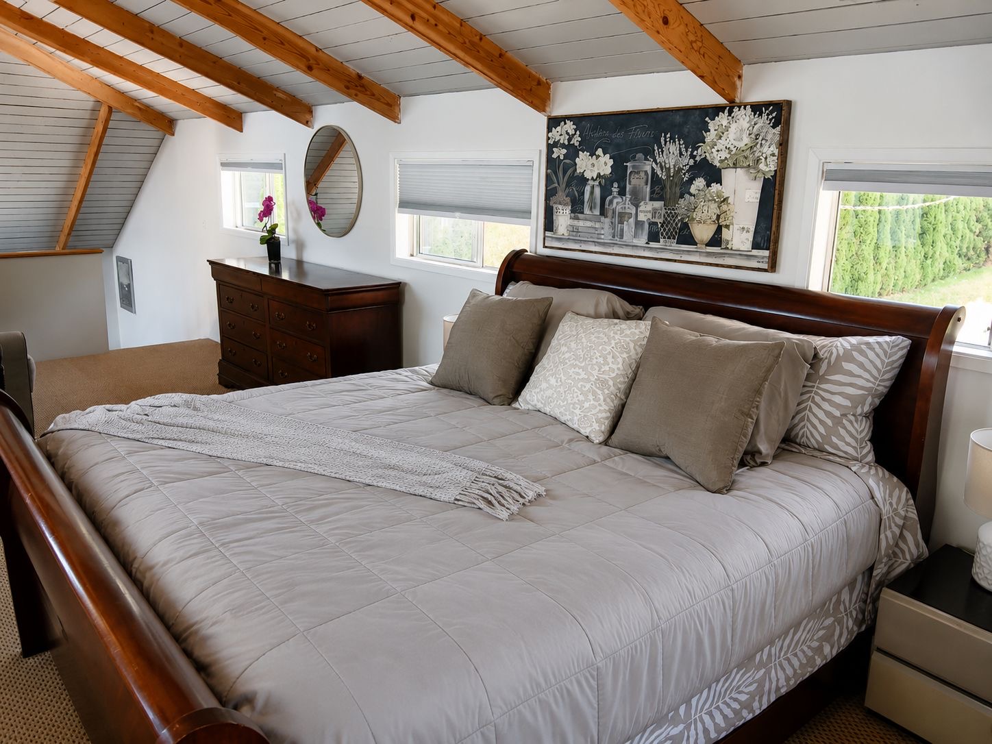 Bedroom 1 King. Comfortable king bed in a bright, peaceful bedroom, offering a relaxing place to unwind after a day at the lake.